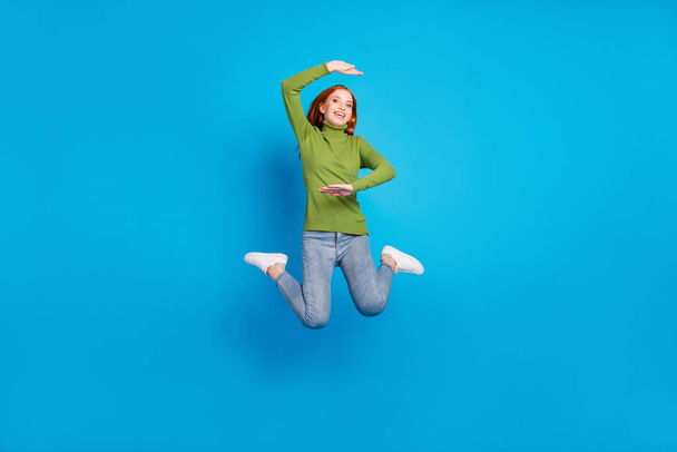 Full length body size view of attractive cheerful girl jumping showing size measure isolated over bright blue color background. - Φωτογραφία, εικόνα