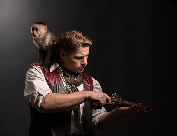 Man adventurer with monkey companion - Foto, immagini