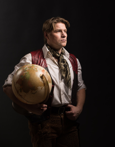 Mature man with old globe - Foto, afbeelding