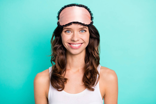 Photo of friendly person toothy smile sleep mask on forehead isolated on pastel teal color background. - Foto, Imagem