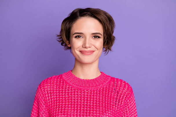 Portrait of optimistic girl wear pink sweater isolated on violet color background. - Фото, изображение