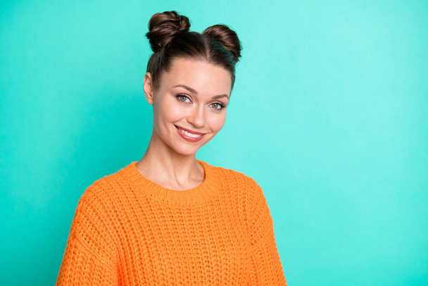 Photo portrait of pretty girl with girlish hairdo smiling wearing orange knitted sweater isolated vivid teal color background. - Foto, Imagen