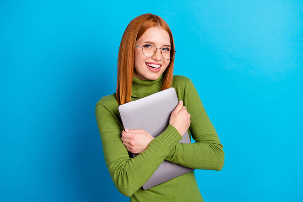 Portrait of attractive intellectual cheerful girl hugging laptop good mood isolated over bright blue color background. - Fotografie, Obrázek