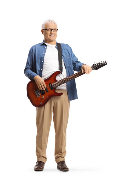 Full length portrait of a mature man posing with an electric guitar isolated on white background - Foto, afbeelding