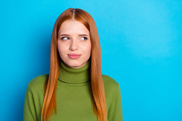 Photo of charming lovely young woman red hair look empty space wear green turtleneck isolated on blue color background. - Φωτογραφία, εικόνα