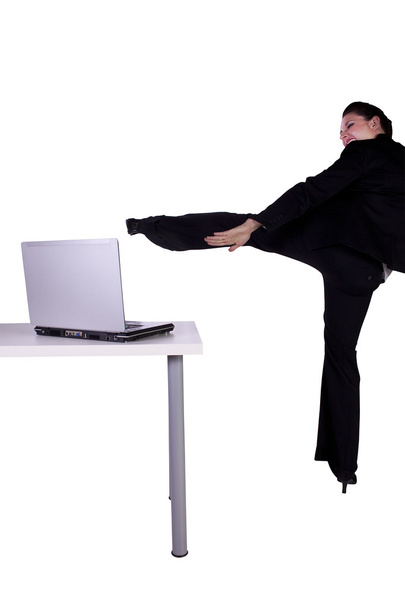 Beautiful Upset Businesswoman Kicking Laptop - Foto, Imagem