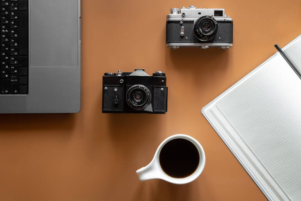 Flat lay composition with photographers equipment and coffee on color background. - Photo, image