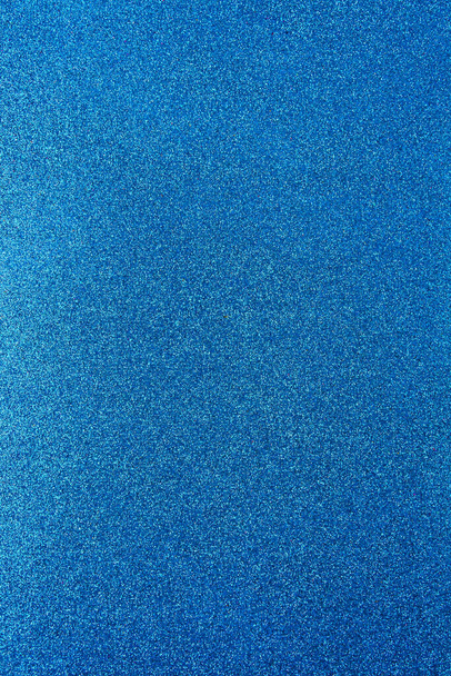 Fundo com brilhos. Antecedentes com brilho. superfície texturizada brilhante. Imagem vertical. Azul forte. Luz suave - Foto, Imagem