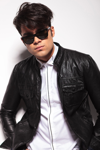 young fashion man wearing a black leather jacket  - Фото, зображення