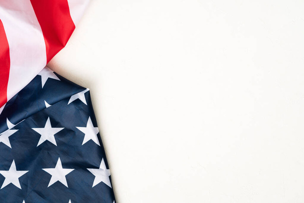 Concept of U.S Independence day or Memorial day. National flag over bright marble table background. - Photo, Image