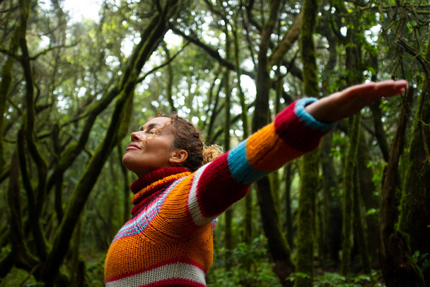 Freedom and happiness, lifestyle and moment. Standing middle age young woman open arms and smile. Success life and nature feeling. Outdoors nature lover. Protect woods and sustainability future - Photo, Image