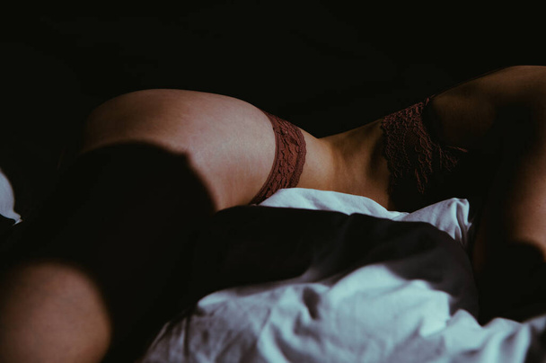 Beautiful young woman sleeping on bed at bedroom - Fotoğraf, Görsel