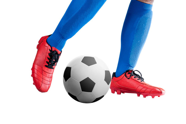 Football player man in a blue jersey kicking the ball posing isolated over white background - Photo, image
