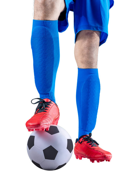 Football player man in a blue jersey with the ball posing isolated over white background - Φωτογραφία, εικόνα