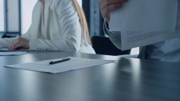 Bank client hands checking contract in office closeup. Unknown young businessman manager analyze financial legal agreement with business partner. Man holding pen papers. Corporate partnership concept - Footage, Video
