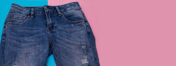 frayed jeans on colorful background - Foto, afbeelding