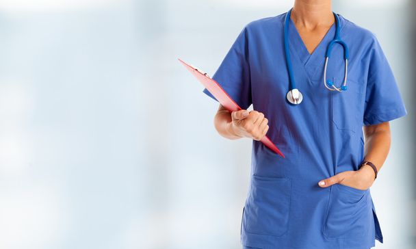 Nurse in front of bright background - Fotó, kép
