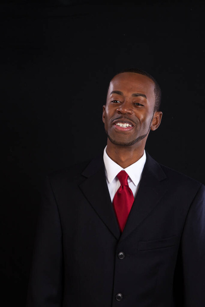 Handsome black businessman with a pleasing smile - Foto, Imagem