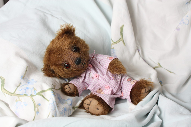 Cute teddy bear in roze pyjama 's - Foto, afbeelding