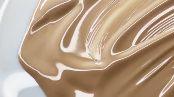 Glossy cosmetic texture, beige liquid foundation or concealer as beauty make-up product background, skincare cosmetics and luxury makeup brand design concept - Footage, Video