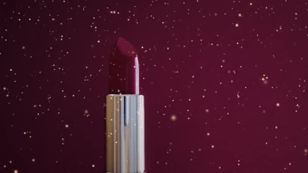 Red lipstick as luxury cosmetic product and golden glitter, make-up ad and beauty brand concept - Footage, Video