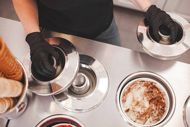 Process of making ice cream. Professional ice cream dessert making in cafeteria. Ice cream equipment. - Fotó, kép