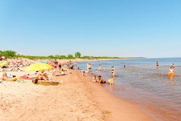 Vacation tourists at the beach in summer hot bright summer day.Klaipeda Lithuania June 24 2022. - Photo, Image