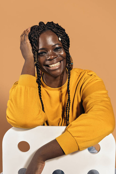Stock photo of beautiful black woman smiling and having fun in studio shot. - Fotó, kép