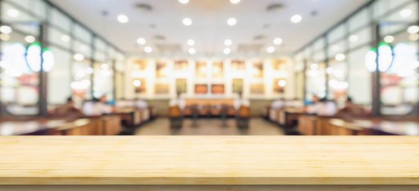 Empty wood table top with cafe restaurant interior blurred background - Photo, Image