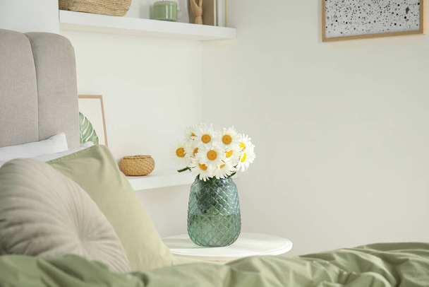 Bouquet of beautiful daisy flowers on table in bedroom - Photo, Image