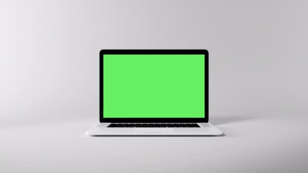Il computer portatile di visualizzazione dello schermo verde si apre e ingrandisce su uno sfondo bianco. Monitor verde vuoto per videochiamate, presentazione di modelli di siti web o applicazioni di gioco. Monitor schermo vuoto rendering 3D - Filmati, video
