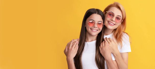 Mother and daughter child banner, copy space, isolated background. happy family portrait of lovely mother and daughter in glasses, family - Foto, immagini