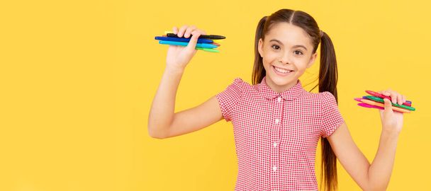 smiling child ready to draw picture. office supplies for school. stationery for painting. Portrait of school girl student, studio banner header. School child pupil face, copy space - Photo, Image