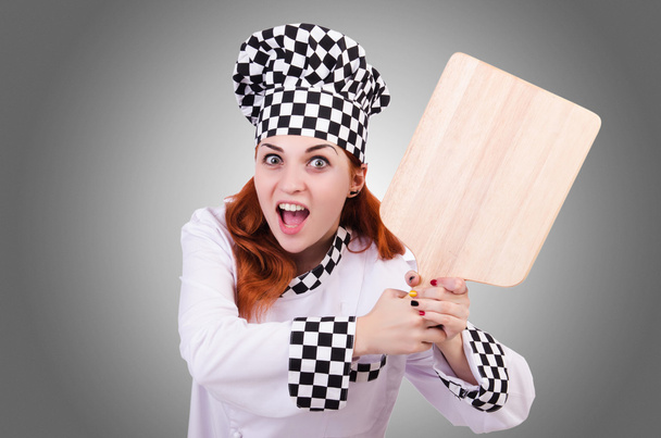 Mulher cozinheiro com tábua de madeira
 - Foto, Imagem