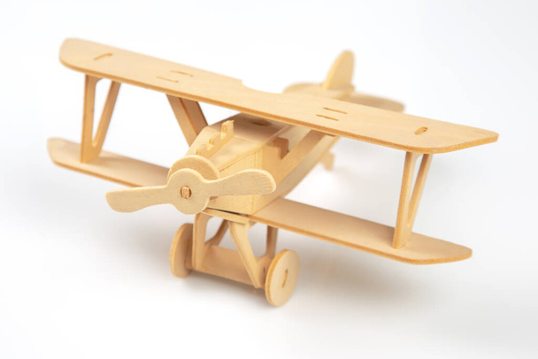 Wooden aircraft model. constructor for assembling toys - Fotoğraf, Görsel