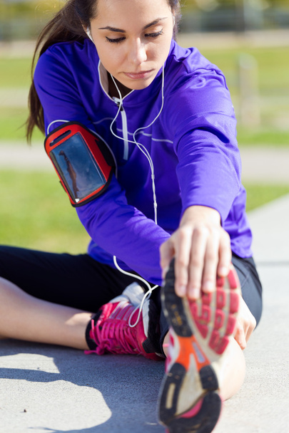 Young woman stretching and preparing for running  - 写真・画像