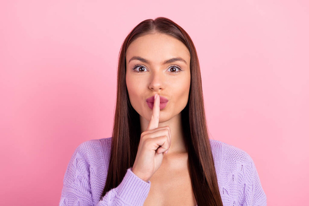 Photo of young happy voiceless woman hold finger lips mute secret isolated on pink color background. - Foto, afbeelding