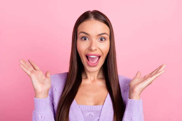 Photo of happy amazed young woman raise hands shocked sale news isolated on pastel pink color background. - Foto, imagen
