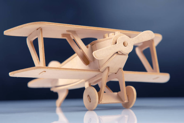 Wooden aircraft model. constructor for assembling toys - 写真・画像
