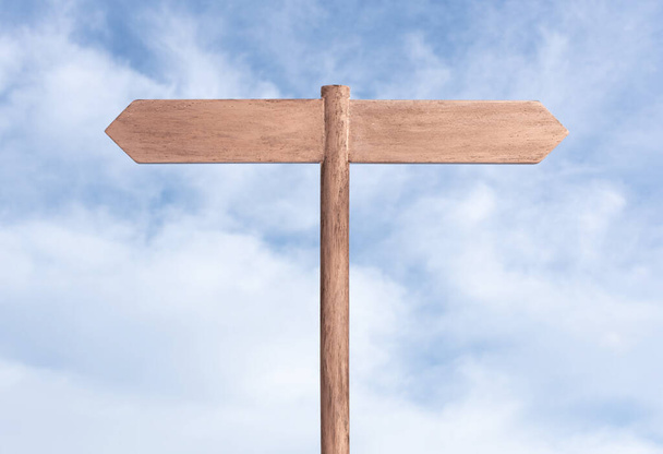 Blank Signpost with two planks on opposite way and sky background. Mock up, template - Photo, Image