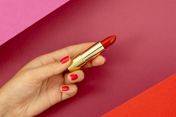 top view woman holding red lipstick - Zdjęcie, obraz