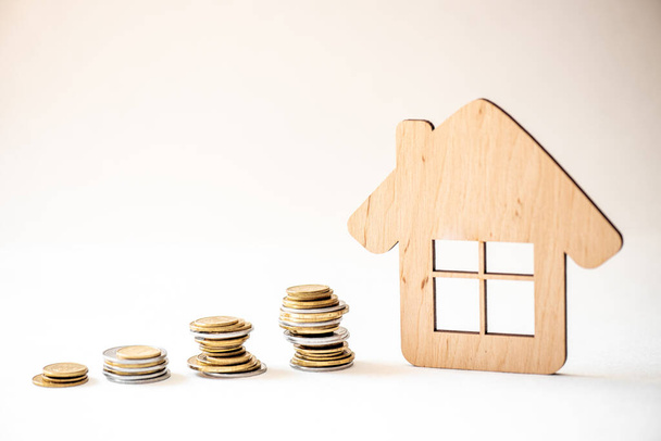 Coin money and house model on wooden background , Finance and banking concept. - Photo, Image