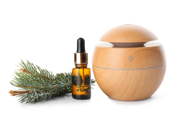 Aroma oil diffuser and coniferous essential oil on white background - Photo, image