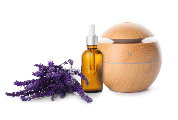 Aroma oil diffuser and lavender essential oil on white background - Foto, imagen