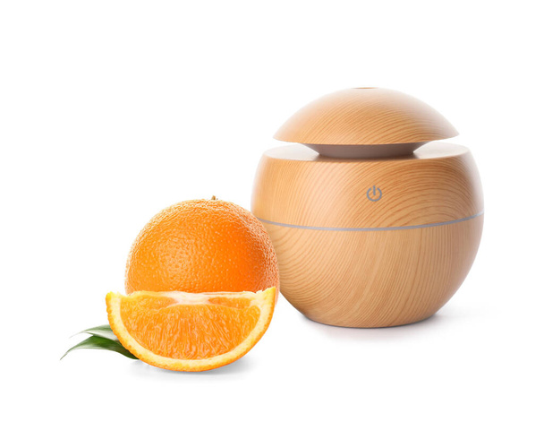 Aroma oil diffuser and orange on white background - Photo, image