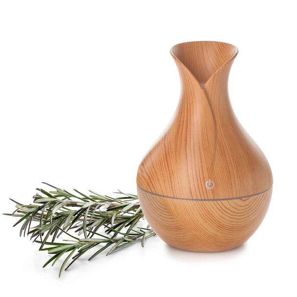 Aroma oil diffuser and rosemary on white background - 写真・画像