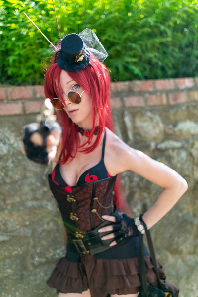 Lucca Comics free cosplay event around city steampunk girl with red hair. High quality photo - Fotoğraf, Görsel