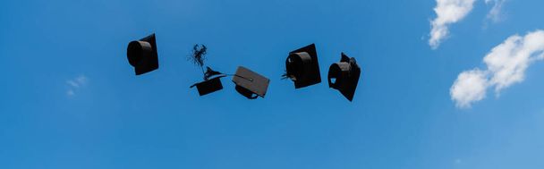 Low angle view of bachelor caps with sky at background, banner  - Fotó, kép