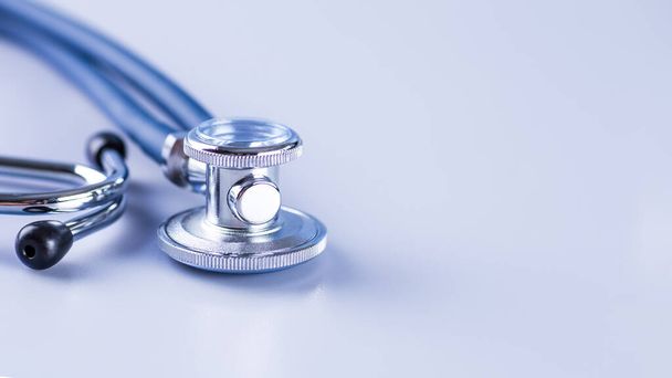 Medical concept image. Stethoscope on white background close up.A lot copy space around the product.Blue stethoscope.Healthcare. - 写真・画像