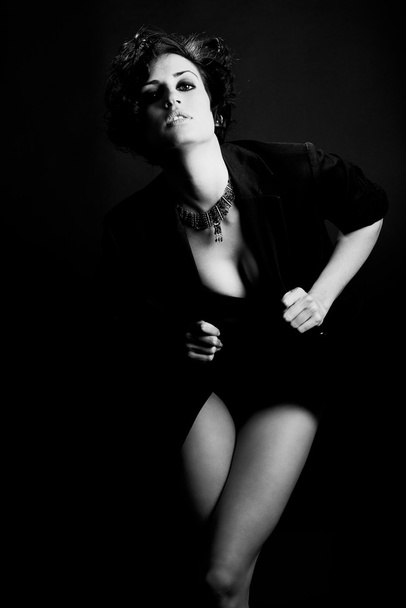 Woman with intense look on black background - Zdjęcie, obraz